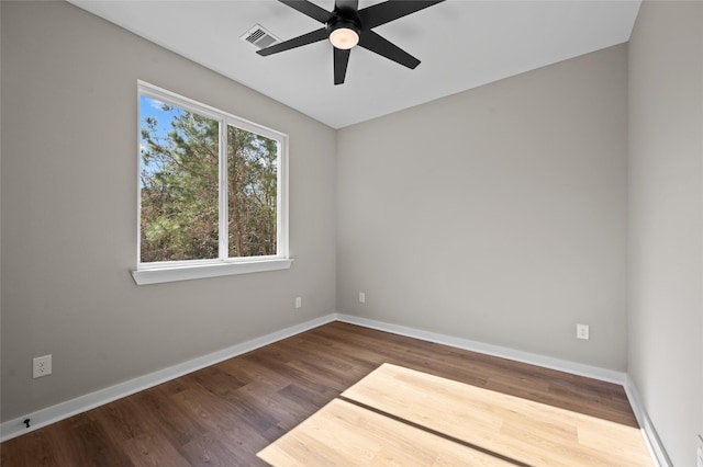 empty room with ceiling fan and hardwood / wood-style floors