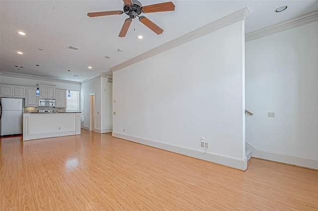 unfurnished living room featuring light hardwood / wood-style floors, ceiling fan, and crown molding