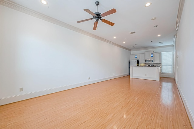 unfurnished living room with ceiling fan, light wood-type flooring, and ornamental molding