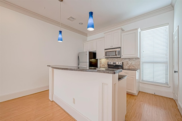 kitchen featuring stainless steel appliances, white cabinetry, a healthy amount of sunlight, and light hardwood / wood-style floors