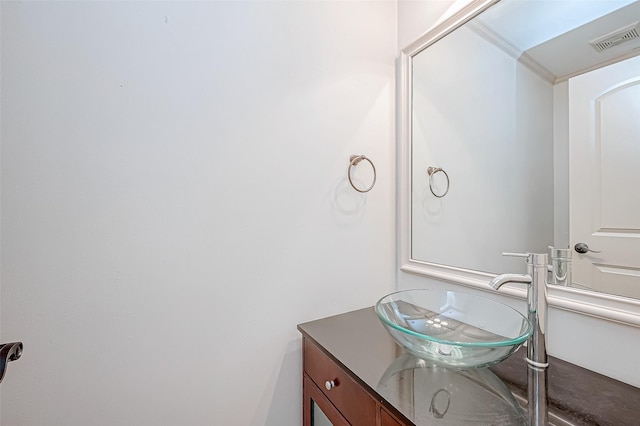 bathroom featuring vanity and crown molding