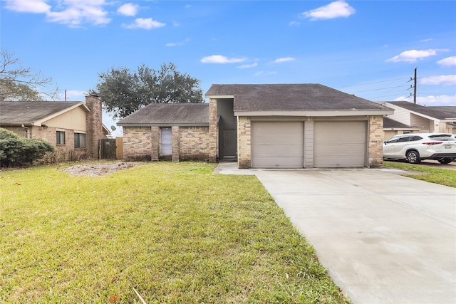 view of front of property with a front yard and a garage