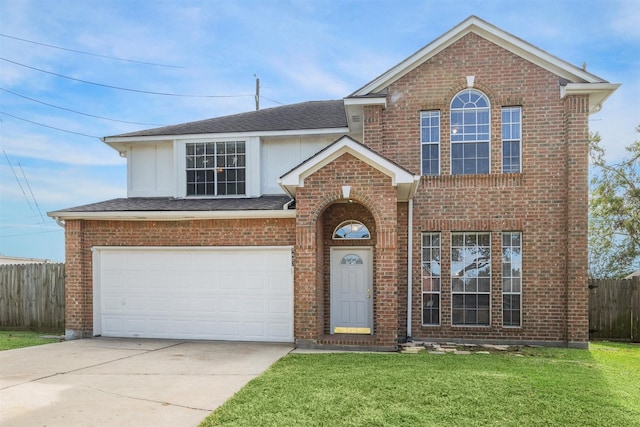 view of front property featuring a garage and a front lawn