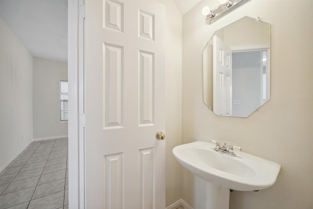 bathroom with tile patterned flooring and sink