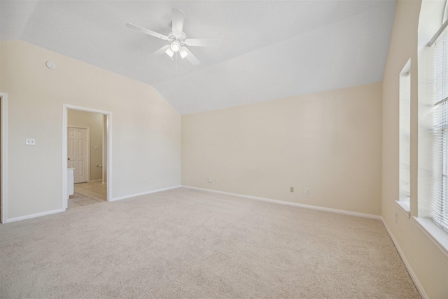 unfurnished room with light carpet, ceiling fan, and lofted ceiling