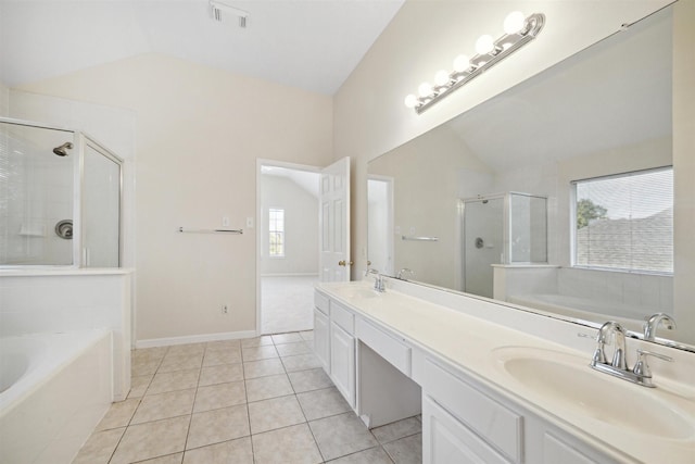 bathroom featuring tile patterned flooring, vanity, lofted ceiling, and shower with separate bathtub