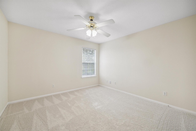 empty room with light carpet and ceiling fan