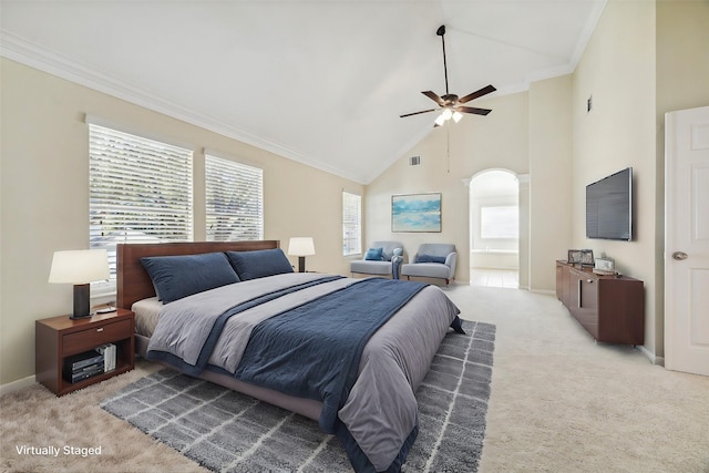 bedroom featuring ceiling fan, light carpet, high vaulted ceiling, and multiple windows