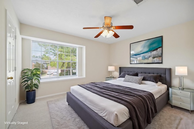 carpeted bedroom with ceiling fan