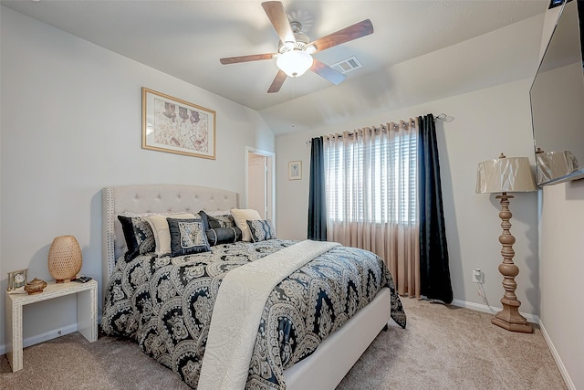 bedroom featuring ceiling fan, light carpet, and lofted ceiling