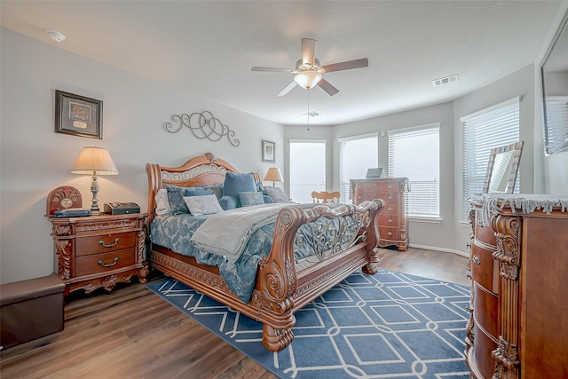 bedroom featuring dark wood-type flooring and ceiling fan