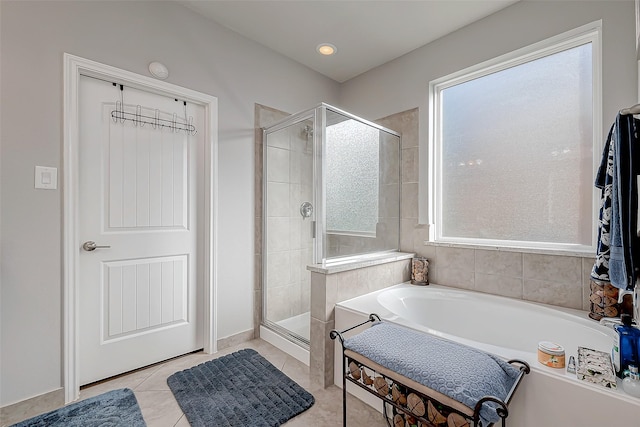 bathroom featuring separate shower and tub and tile patterned flooring