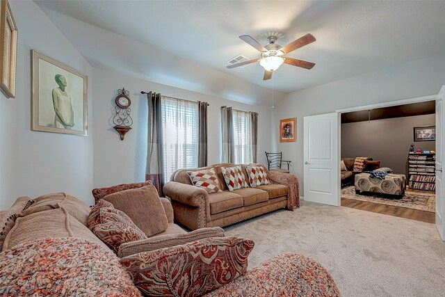 living room featuring ceiling fan and carpet flooring