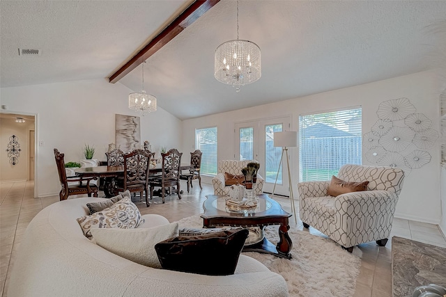 living room featuring a chandelier, a textured ceiling, vaulted ceiling with beams, and a healthy amount of sunlight