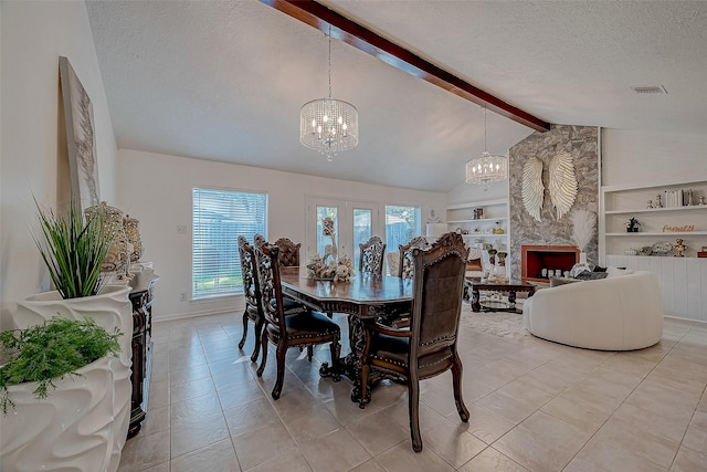 tiled dining room featuring vaulted ceiling with beams, built in features, a textured ceiling, a premium fireplace, and a notable chandelier