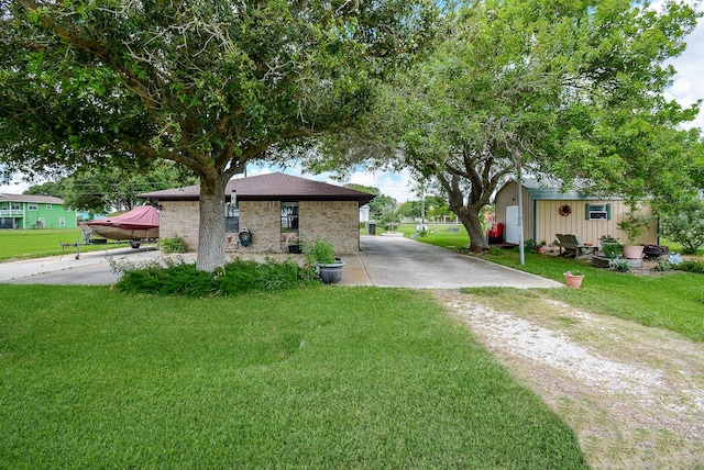 exterior space with an outbuilding and a front yard