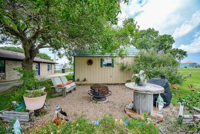 1495 W Bayshore Dr, Palacios, TX 77465 - view of yard with an outdoor fire pit and an outdoor structure