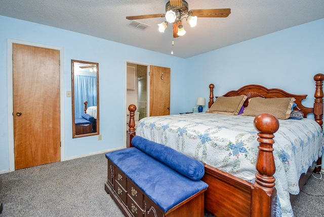 carpeted bedroom featuring a textured ceiling and ceiling fan