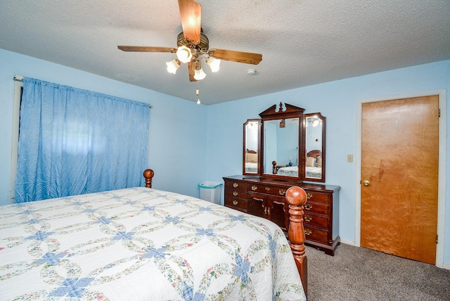 bedroom featuring ceiling fan, carpet, and a textured ceiling