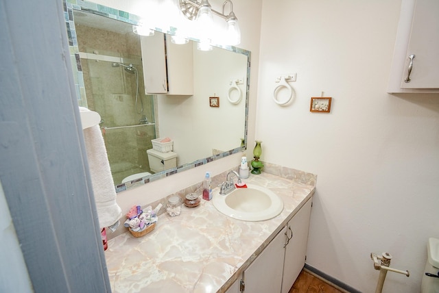 1495 W Bayshore Dr, Palacios, TX 77465 - full bathroom with a stall shower, vanity, and toilet