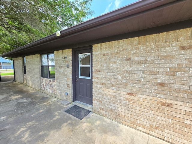 1495 W Bayshore Dr, Palacios, TX 77465 - property entrance with brick siding
