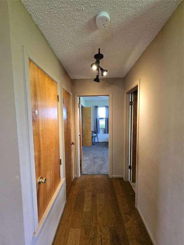 1495 W Bayshore Dr, Palacios, TX 77465 - hall with wood finished floors and a textured ceiling