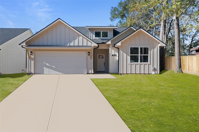 view of front facade featuring a garage and a front lawn