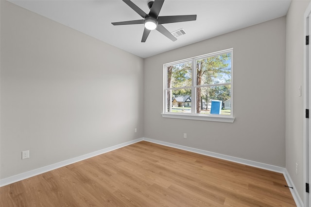 spare room with ceiling fan and light hardwood / wood-style floors