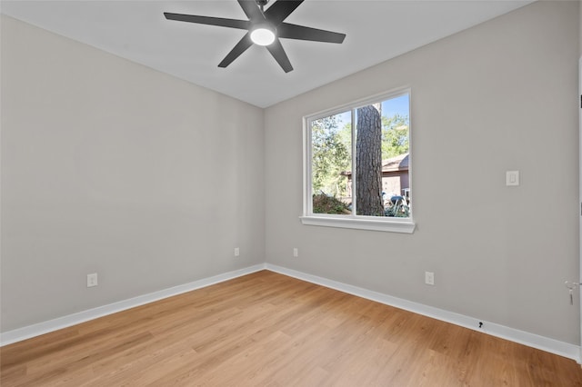 empty room featuring ceiling fan and light hardwood / wood-style flooring