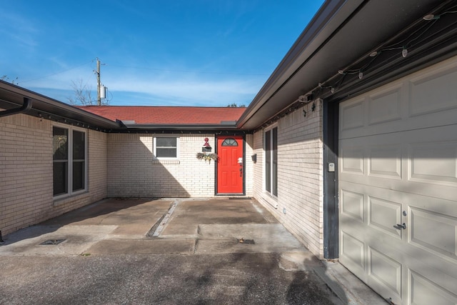 view of exterior entry featuring a garage