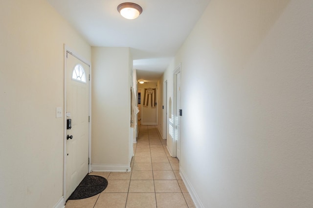 corridor featuring light tile patterned floors