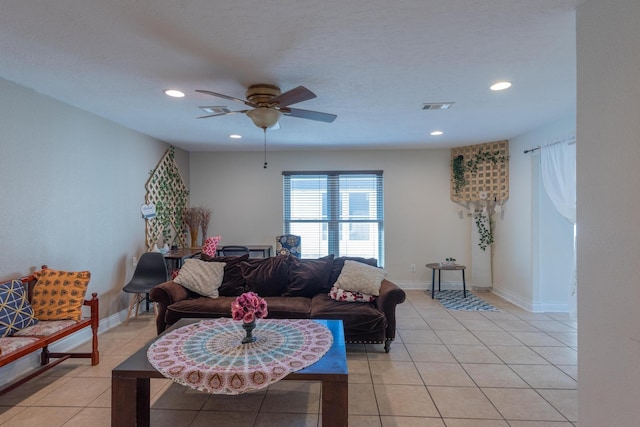 tiled living room with ceiling fan