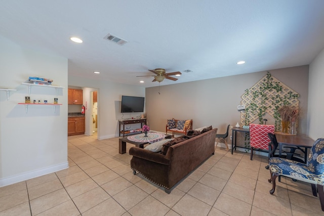 living room featuring ceiling fan and light tile patterned floors