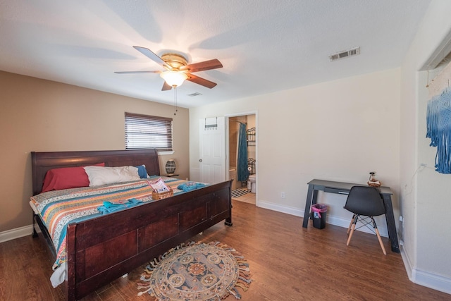 bedroom with dark hardwood / wood-style floors and ceiling fan