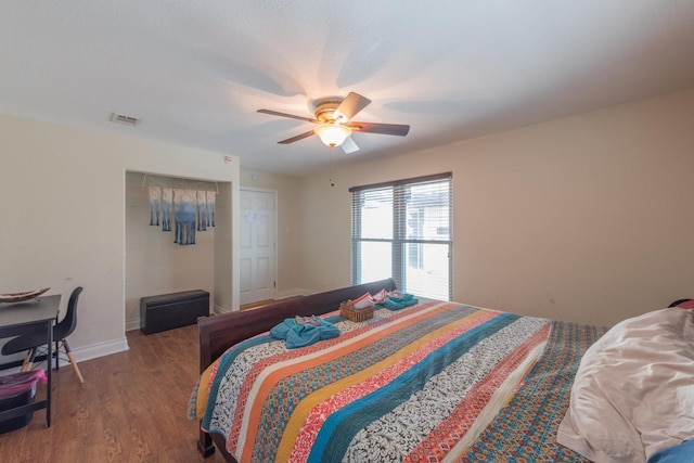 bedroom with hardwood / wood-style flooring and ceiling fan