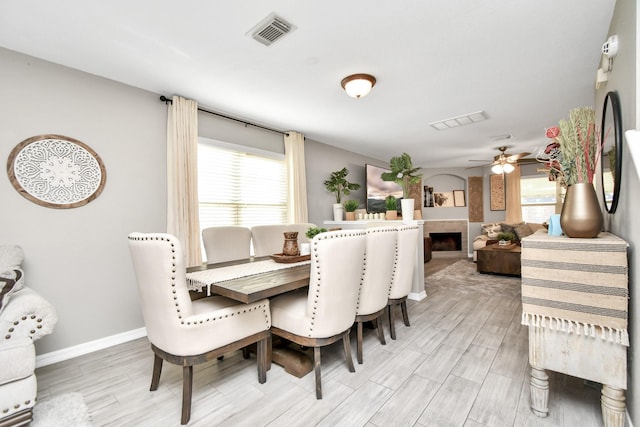 dining room featuring ceiling fan and wood-type flooring