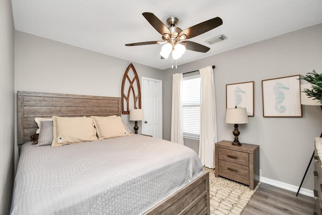 bedroom featuring a closet, ceiling fan, and light hardwood / wood-style flooring