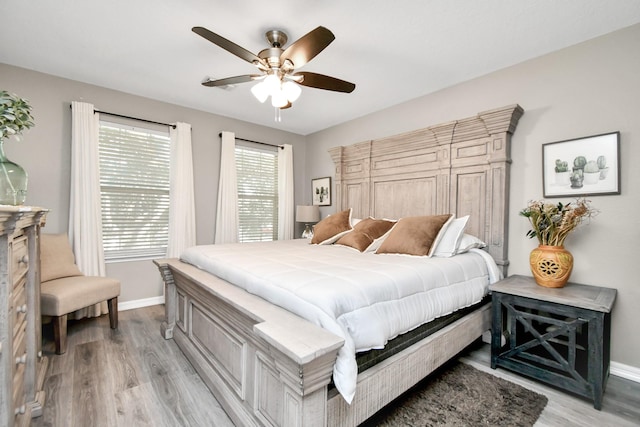 bedroom featuring light wood-type flooring and ceiling fan