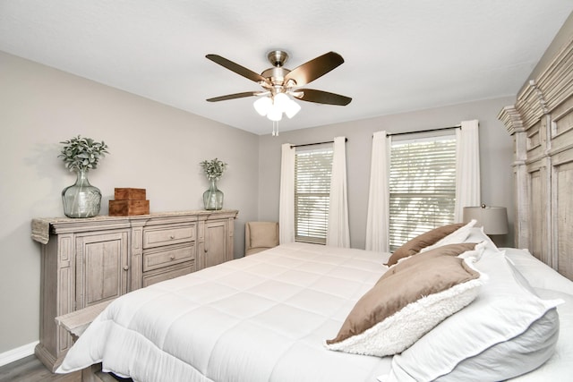 bedroom featuring ceiling fan and wood-type flooring