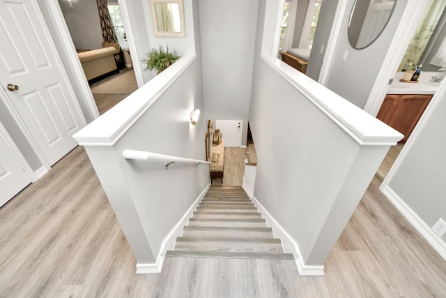 stairs with wood-type flooring