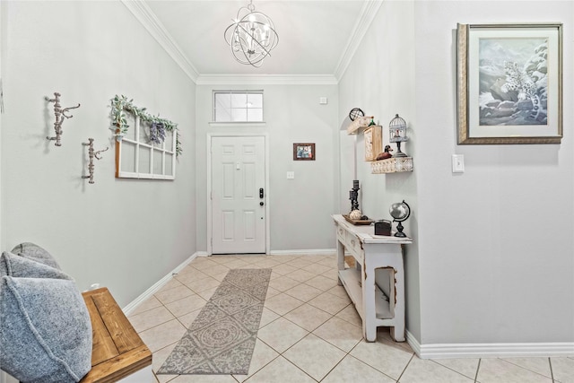 foyer with light tile patterned floors, ornamental molding, a chandelier, and baseboards