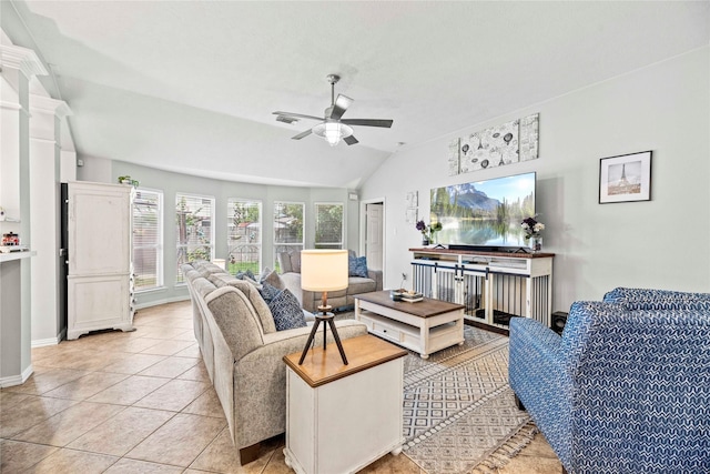 tiled living room featuring vaulted ceiling and ceiling fan