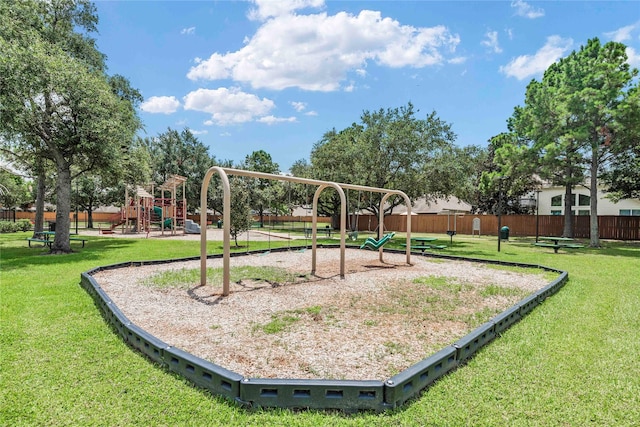 view of jungle gym featuring a lawn