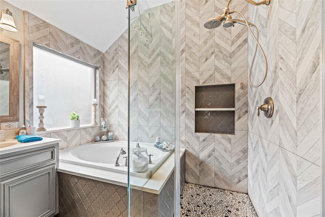 bathroom featuring tile patterned floors, vanity, and independent shower and bath