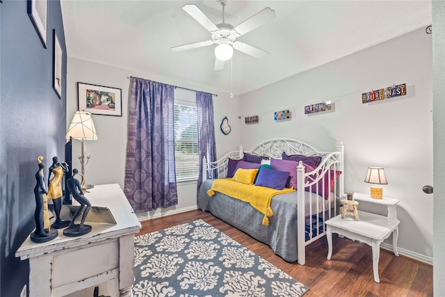 bedroom featuring ceiling fan and dark hardwood / wood-style floors