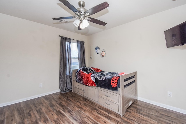 bedroom with ceiling fan and dark wood-type flooring