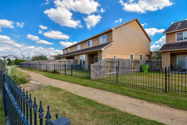 view of side of property with a yard