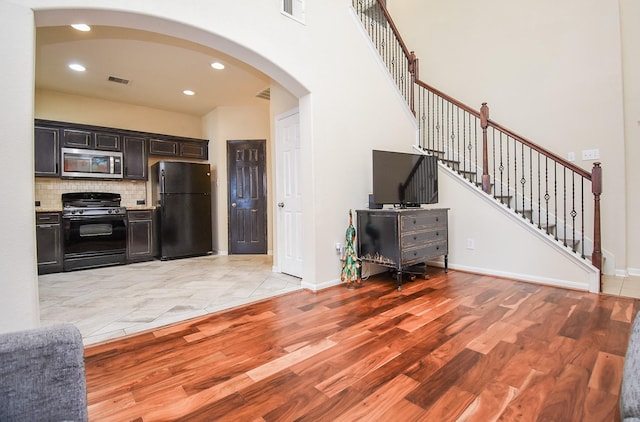 living room with light hardwood / wood-style flooring