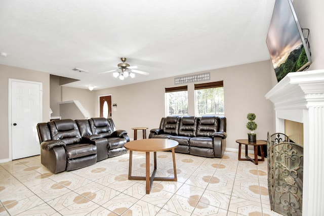 living room with light tile patterned floors and ceiling fan