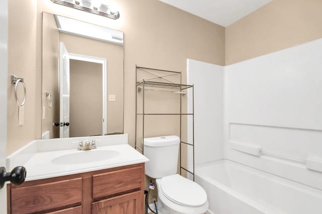 full bathroom with shower / tub combination, vanity, and toilet